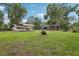 Large yard with a shed and outbuilding offers plenty of space for outdoor activities and storage at 3807 Timberlake N Rd, Lakeland, FL 33810