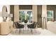 Well-lit dining area featuring modern furniture and view to the backyard at 442 Puma Loop, Groveland, FL 34736