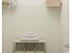 A small but functional laundry area with wire shelving to organize your laundry supplies at 442 Puma Loop, Groveland, FL 34736