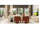 Cozy living room featuring plush seating, bright windows, and stylish decor at 442 Puma Loop, Groveland, FL 34736
