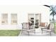 Stylish outdoor patio with seating area and views into the kitchen at 442 Puma Loop, Groveland, FL 34736
