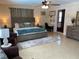 Inviting bedroom featuring a comfortable bed, modern decor and a ceiling fan at 149 County Road 640, Lake Wales, FL 33859