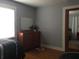 Comfortable bedroom featuring a dresser with mirror and partially obscured twin beds at 149 County Road 640, Lake Wales, FL 33859