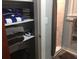 A linen closet filled with towels next to a tiled shower at 149 County Road 640, Lake Wales, FL 33859