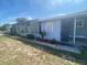 Charming single-story home with a well-maintained lawn and screened lanai, perfect for outdoor living at 149 County Road 640, Lake Wales, FL 33859