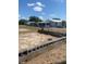 Exterior home and property view with block wall, car port, light blue home, and bright sky at 149 County Road 640, Lake Wales, FL 33859