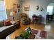 Cozy living area with sofa, armchairs, hardwood flooring and decorative accents at 149 County Road 640, Lake Wales, FL 33859