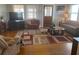 Cozy living room with hardwood floors, area rug and comfortable seating arrangement at 149 County Road 640, Lake Wales, FL 33859