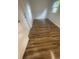 Clean bedroom featuring new floors, fresh paint, and a large window with ample natural light at 1727 Bonita Ave, Orlando, FL 32805