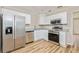 Modern kitchen with stainless steel appliances, granite countertops, and ample cabinet space at 1727 Bonita Ave, Orlando, FL 32805