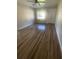 Spacious living room with new flooring, fresh paint, and a large window with lots of natural light at 1727 Bonita Ave, Orlando, FL 32805