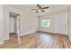 Open living room featuring wood-look floors, neutral walls, and a window for natural light at 1727 Bonita Ave, Orlando, FL 32805