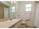 A bathroom featuring a vanity with cabinets and a shower-tub combo at 2214 Deerbrook Dr, Lakeland, FL 33811