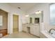 Bright bathroom with double vanities, garden tub and walk-in closet at 2214 Deerbrook Dr, Lakeland, FL 33811