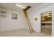 A bonus room featuring drop-down ladder to attic and access to workshop at 2214 Deerbrook Dr, Lakeland, FL 33811