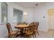 Cozy dining area featuring hardwood floors, a classic table and chairs, and natural light at 2214 Deerbrook Dr, Lakeland, FL 33811