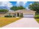 Beautiful home with a well-maintained lawn and a two-car garage at 2214 Deerbrook Dr, Lakeland, FL 33811
