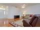 Inviting living room with hardwood floors, neutral furniture, and ample natural light at 2214 Deerbrook Dr, Lakeland, FL 33811