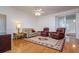 Cozy living room with hardwood floors, neutral furniture, and a decorative rug at 2214 Deerbrook Dr, Lakeland, FL 33811
