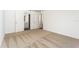 Neutral bedroom with carpet flooring and doors leading to bathroom and closet at 3832 Corsican Pl, Lake Alfred, FL 33850
