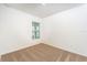Bright bedroom with large window and neutral carpet at 3832 Corsican Pl, Lake Alfred, FL 33850