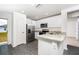 Well-equipped kitchen with stainless steel appliances, granite countertops, and white cabinets at 3832 Corsican Pl, Lake Alfred, FL 33850