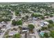 Extensive aerial view of a residential area highlighting the community's layout and landscaping with nearby amenities at 503 Holt Cir, Winter Haven, FL 33880