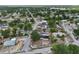 Aerial view showcases home's location within a residential neighborhood with mature trees and various home styles at 503 Holt Cir, Winter Haven, FL 33880