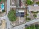 Aerial shot showing roof with solar panels, near roads, pool, and a small trampoline at 503 Holt Cir, Winter Haven, FL 33880