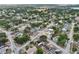 Aerial view of a residential neighborhood with mature trees and community amenities nearby at 503 Holt Cir, Winter Haven, FL 33880