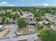 Aerial view of neighborhood featuring home with solar panels and mature trees in residential community at 503 Holt Cir, Winter Haven, FL 33880