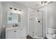 Modern bathroom featuring a corner shower with glass doors, vanity, and toilet at 503 Holt Cir, Winter Haven, FL 33880