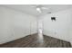 Bedroom with hardwood flooring, closet and ceiling fan with connecting hall access at 503 Holt Cir, Winter Haven, FL 33880