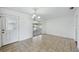 Bright dining room with neutral tile flooring, chandelier, and access to a covered lanai at 503 Holt Cir, Winter Haven, FL 33880