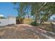 Exterior of home with a long driveway, large shade tree, and fenced yard at 503 Holt Cir, Winter Haven, FL 33880