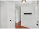 Bright hallway with coat rack and access to the living areas at 503 Holt Cir, Winter Haven, FL 33880