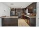Open concept kitchen featuring stainless steel appliances, granite countertops, and tile backsplash at 503 Holt Cir, Winter Haven, FL 33880