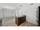 Eat-in kitchen island with granite countertop and lots of cabinet space and adjacent breakfast area at 503 Holt Cir, Winter Haven, FL 33880