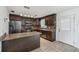 Spacious kitchen boasts stainless steel appliances, granite countertops, and tile floors at 503 Holt Cir, Winter Haven, FL 33880