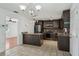 Bright kitchen features modern stainless steel appliances, granite counters, and tile flooring at 503 Holt Cir, Winter Haven, FL 33880