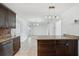 Kitchen with granite countertop island and stainless steel dishwasher with access to the breakfast area at 503 Holt Cir, Winter Haven, FL 33880
