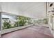 Enclosed screened porch with plants and privacy fence at 503 Holt Cir, Winter Haven, FL 33880