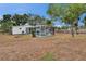 Expansive backyard featuring a screened pool area at 750 Azalea Dr, Bartow, FL 33830