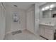Bathroom with light gray vanity and patterned tile flooring at 750 Azalea Dr, Bartow, FL 33830
