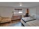 Comfortable bedroom featuring wood-look floors, lots of natural light, neutral walls for a relaxing atmosphere at 750 Azalea Dr, Bartow, FL 33830