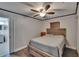 A light-filled bedroom features wood-look flooring and a rustic bed frame at 750 Azalea Dr, Bartow, FL 33830