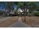 Charming home with mature trees and long driveway with RV parking in front yard at 750 Azalea Dr, Bartow, FL 33830