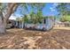 Charming exterior detail with manicured landscaping, RV Parking, and fenced-in backyard at 750 Azalea Dr, Bartow, FL 33830