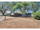 Charming home with mature trees and long driveway with RV parking in front yard at 750 Azalea Dr, Bartow, FL 33830