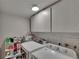 Efficient laundry room features modern washer and dryer with lots of upper cabinet storage and utility shelving at 750 Azalea Dr, Bartow, FL 33830